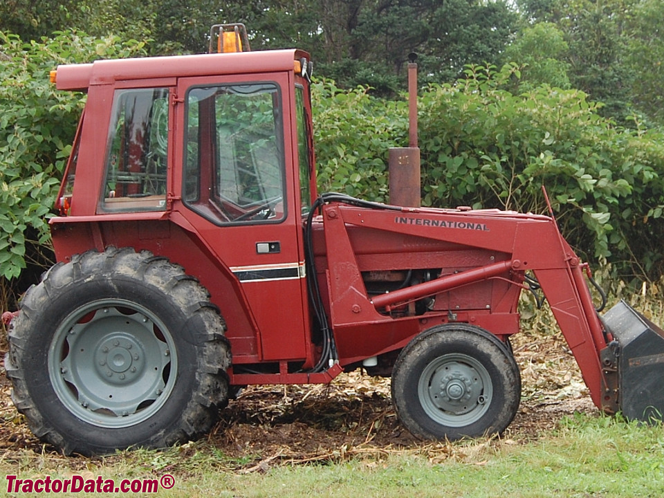 International 484 with Simms cab and model 2200 front-end loader.