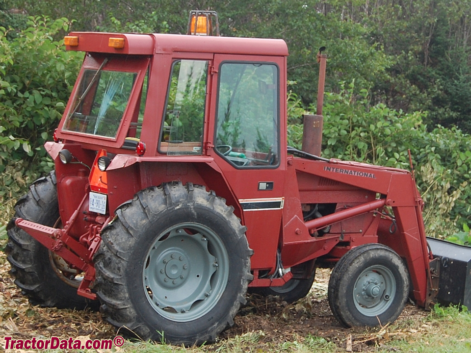 International 484 with Simms cab and model 2200 front-end loader.