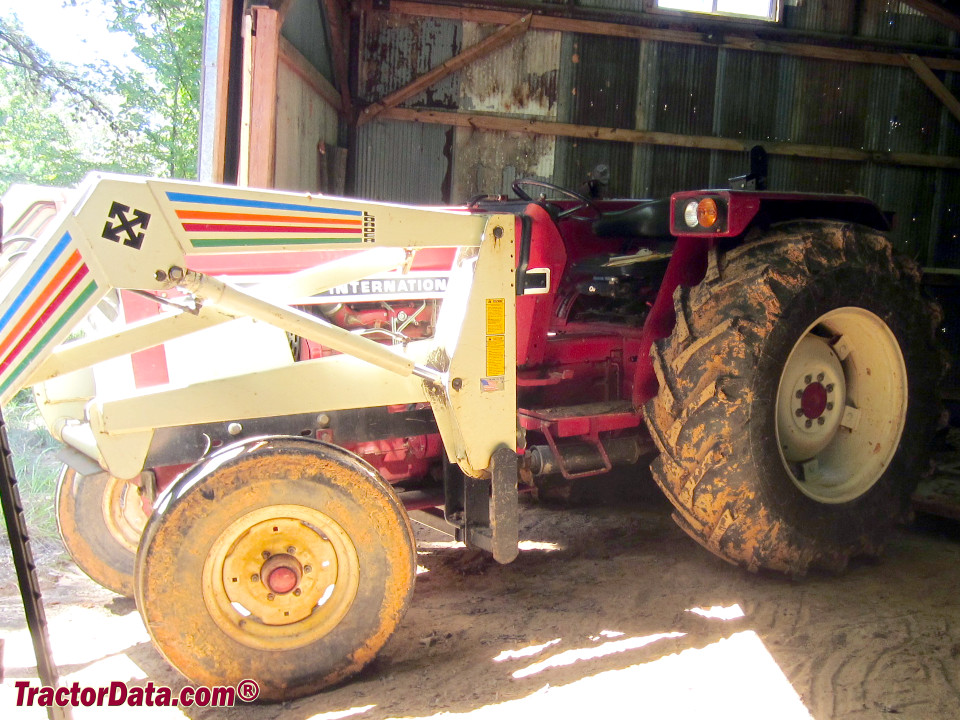 International 784 with front-end loader, left side.
