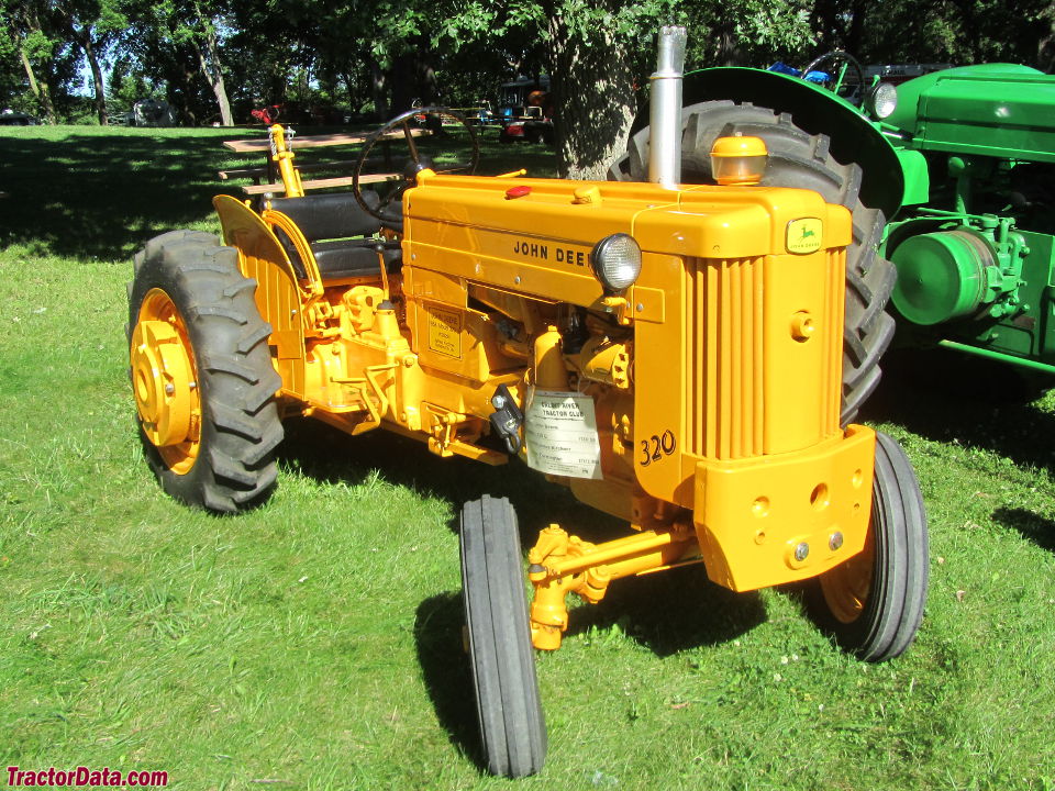 John Deere 320U utility in industrial yellow