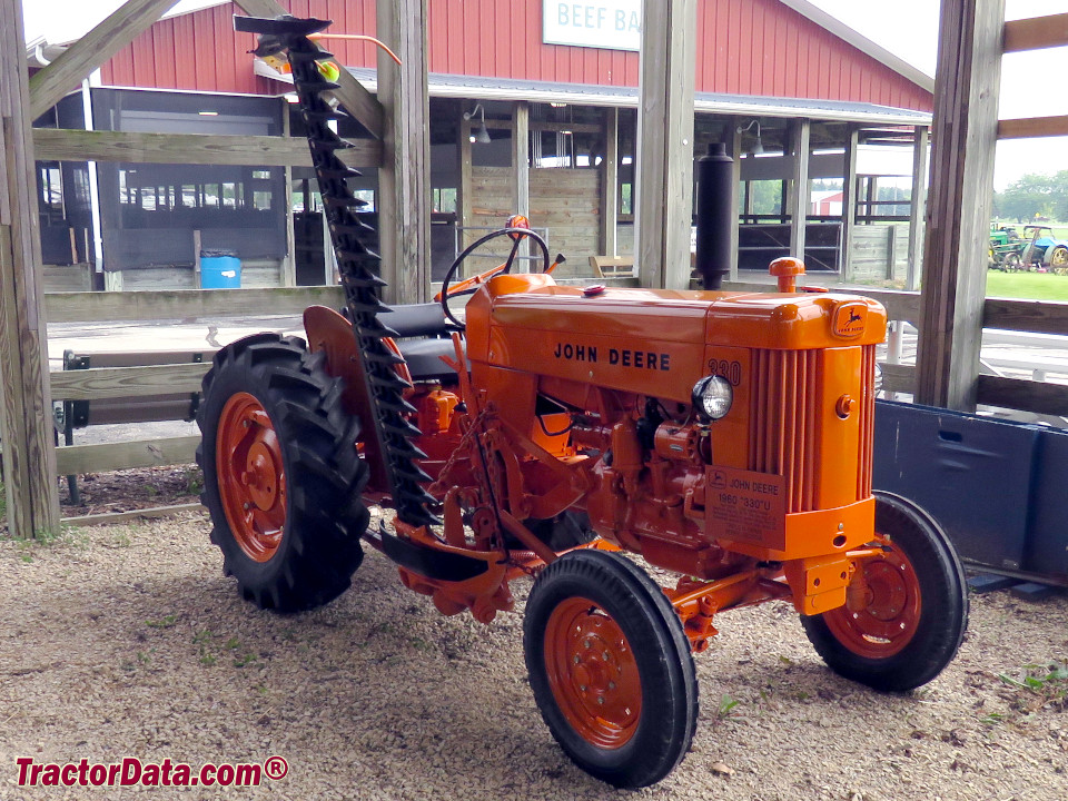 John Deere 330U in highway orange with model 47 sickle mower.