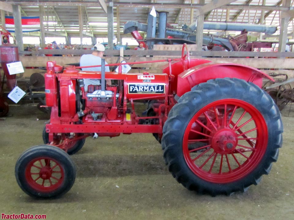 Red Farmall F-12 with wide front end.