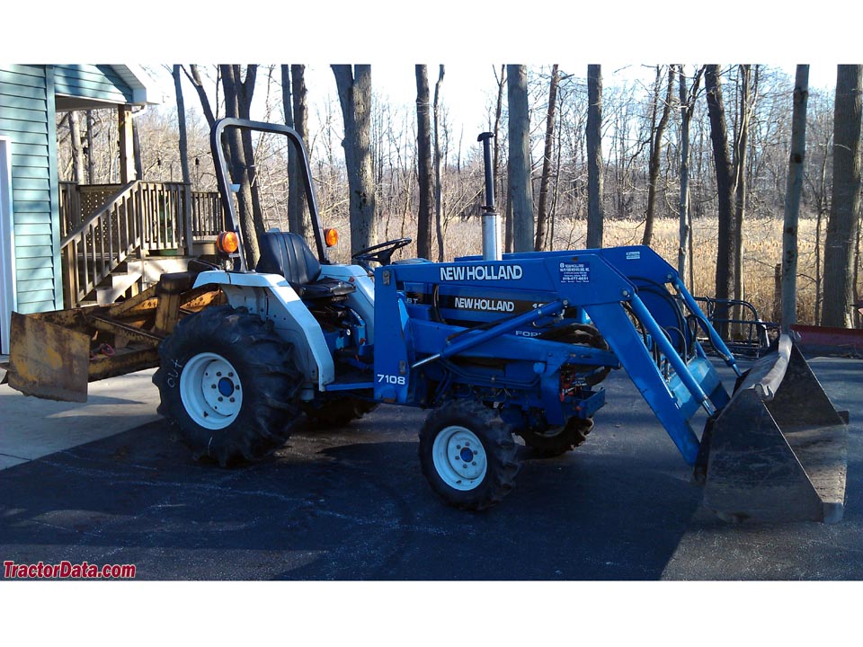 New Holland 1620 with box blade and model 7108 loader.