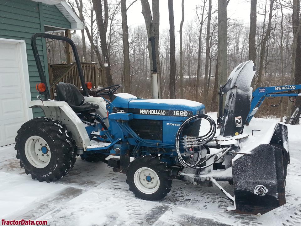 New Holland with New Holland 716b front-mount snow blower.