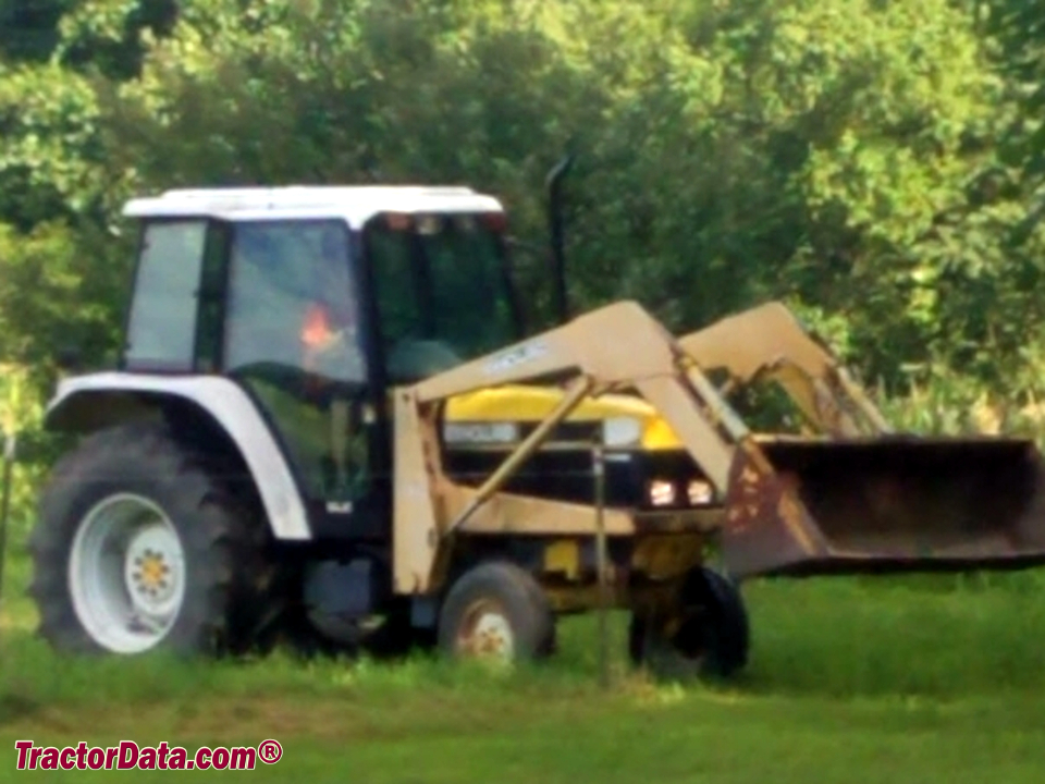 New Holland 7740 with 7210 front-end loader, right side.