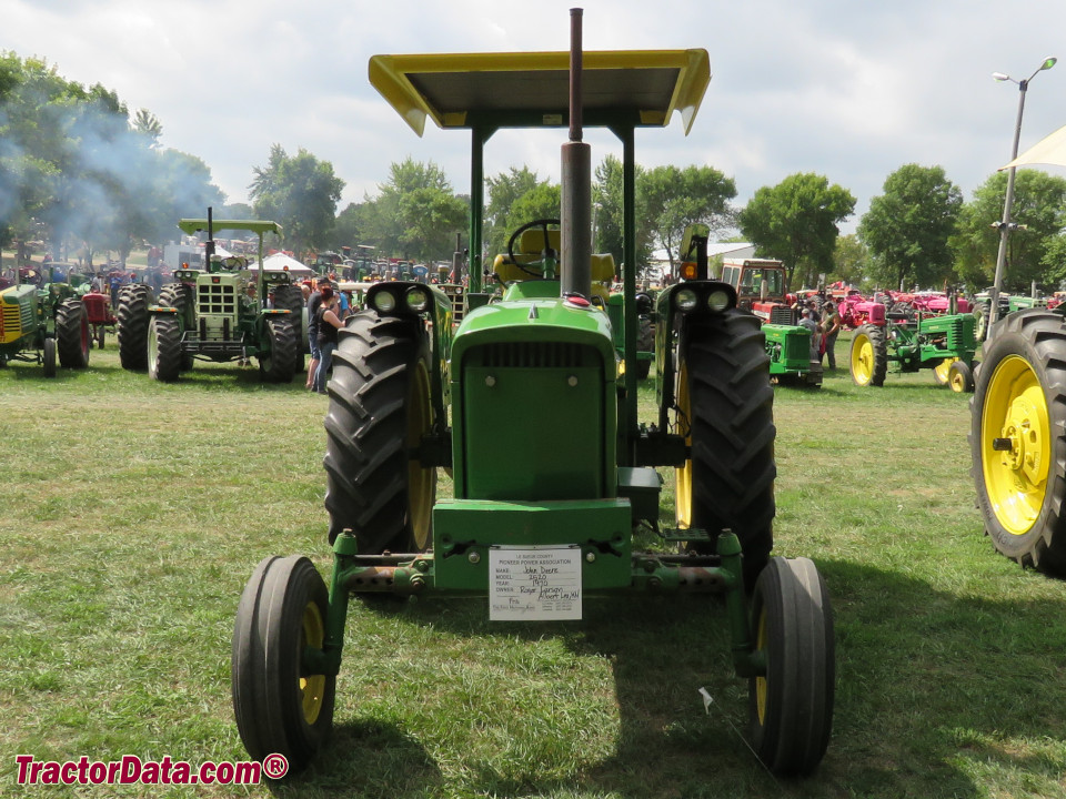 John Deere 2520 row-crop tractor with semi-mounted plow.