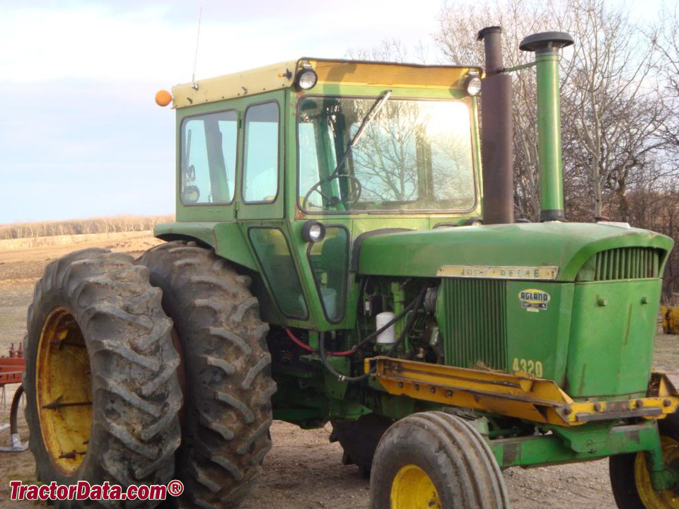 Two-wheel drive John Deere 4320 with cab and duals.