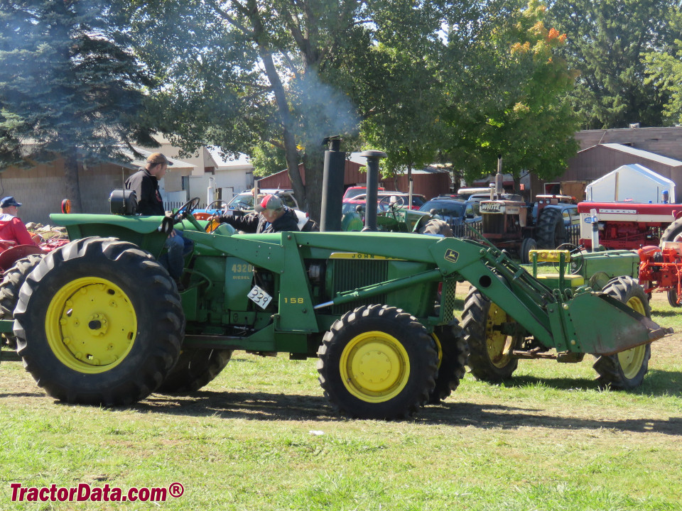 Four-wheel drive John Deere 4320 with model 158 front-end loader.