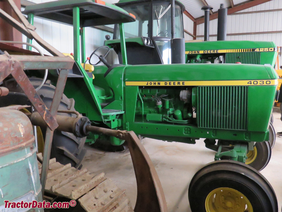 John Deere 4030 tractor with ROPS and gasoline engine.