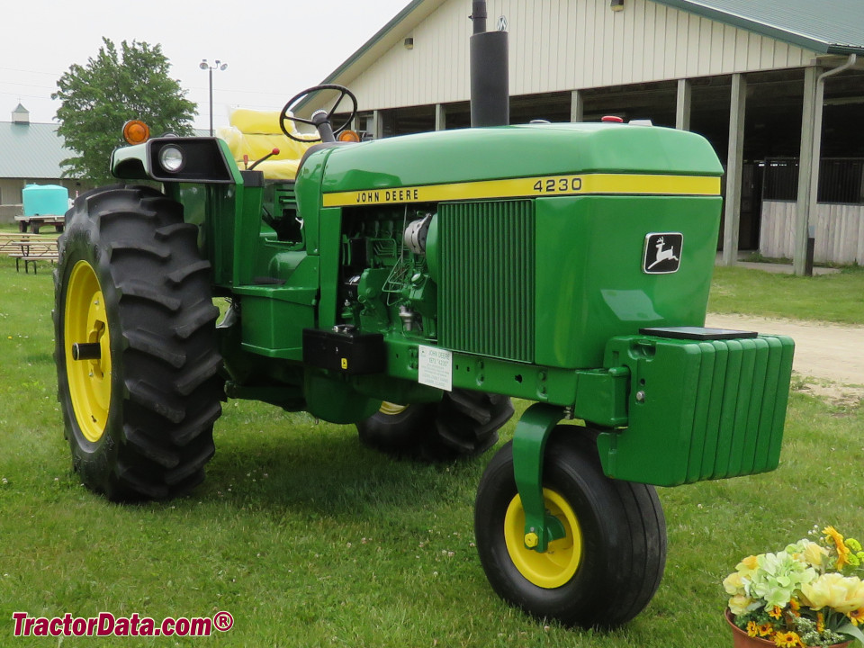Open station John Deere 4230 tractor with single front wheel.