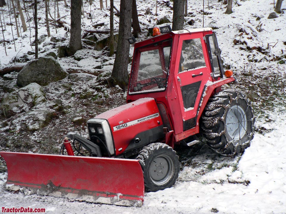 Massey Ferguson 1240 with cab and blade.