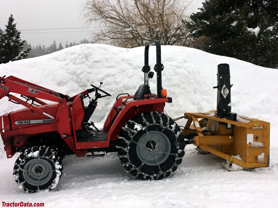 Massey Ferguson 1240 with loader and rear snowblower.