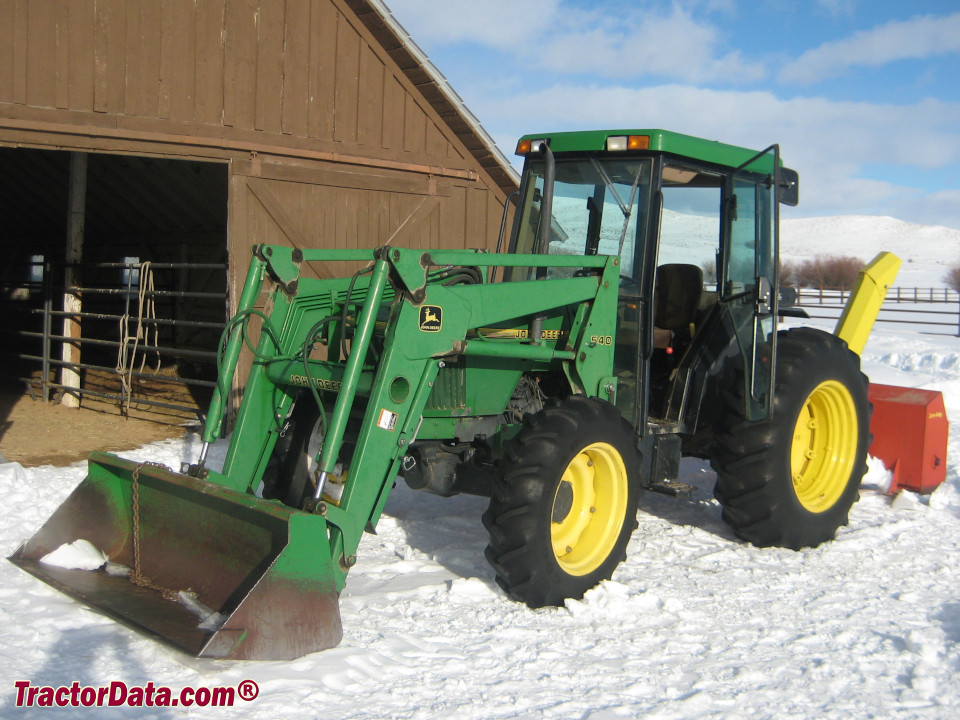 Four-wheel drive John Deere 5500 with cab and 540 front-end loader.