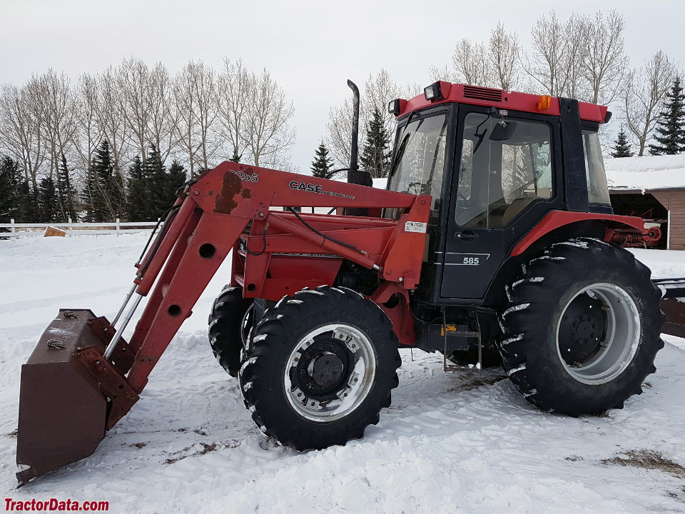 Four-wheel drive Case IH 585 with cab and loader.