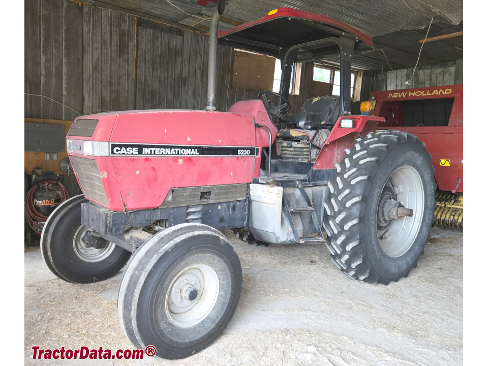 Case International 5230 utility tractor with ROPS.