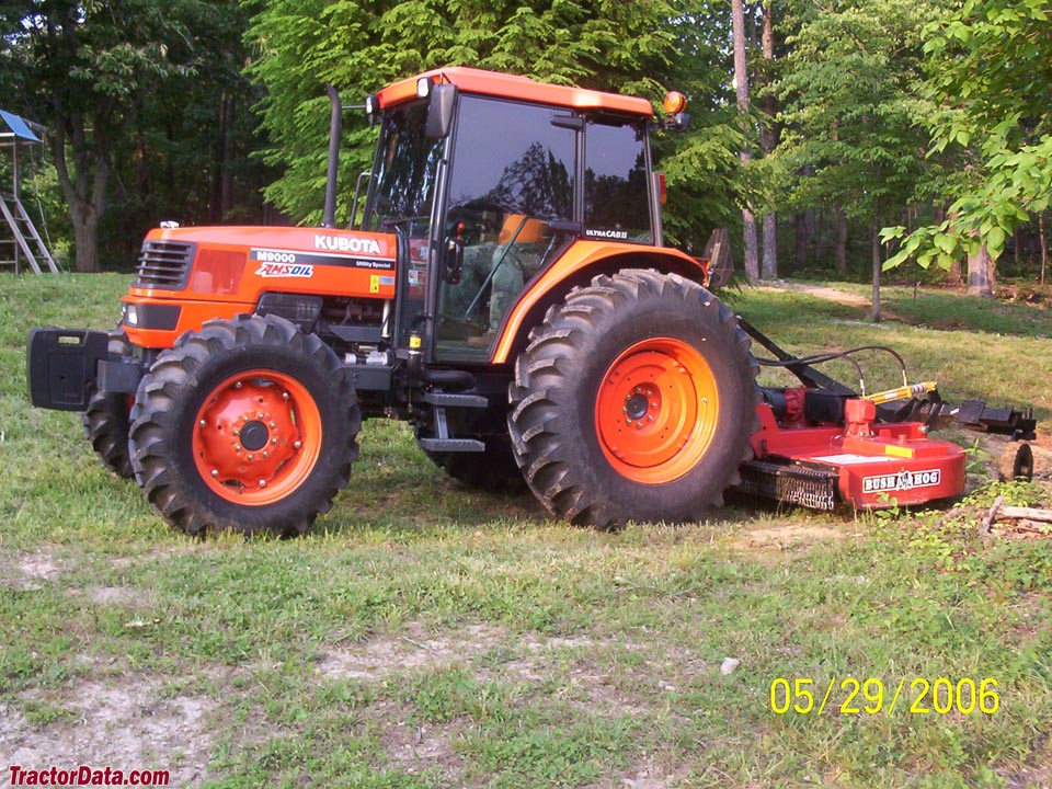 Kubota M9000 with rotary cutter, left side.