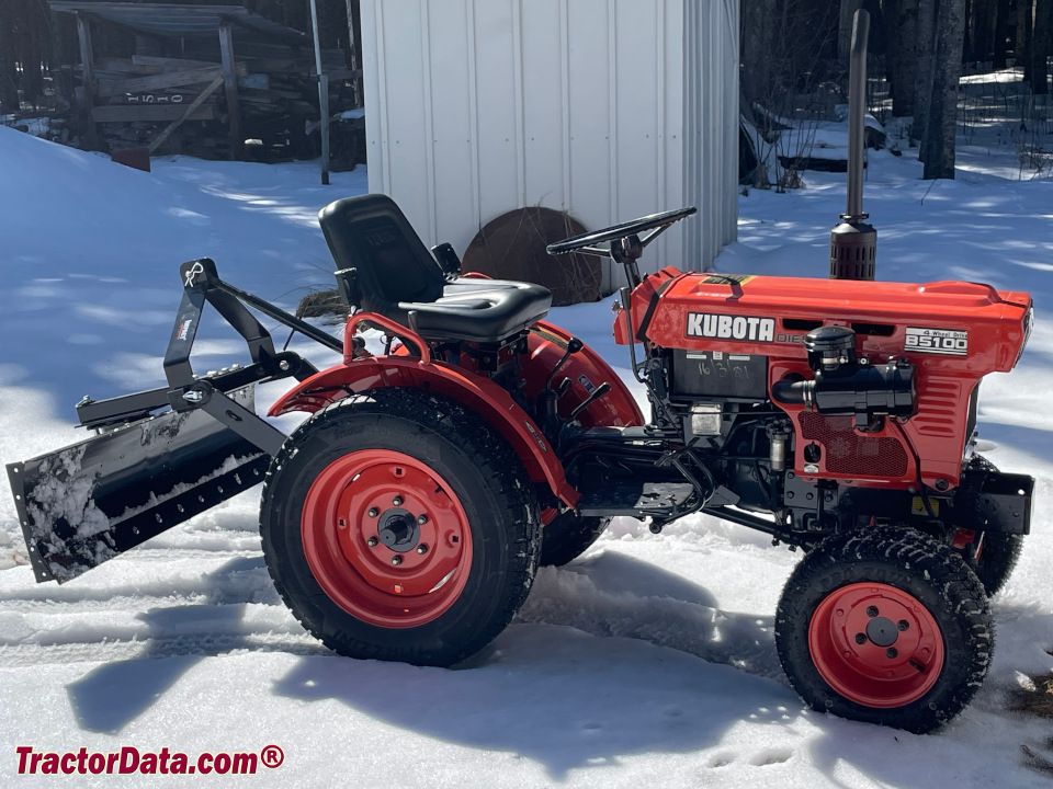 Four-wheel drive Kubota B5100DT compact utility tractor with rear blade.