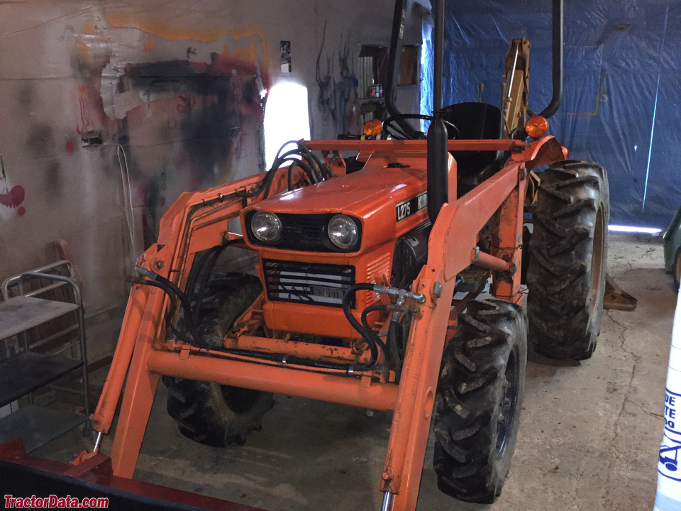 Kubota L275 with front-end loader.