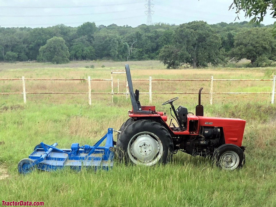 Belarus 3011 with rotary cutter, right side.