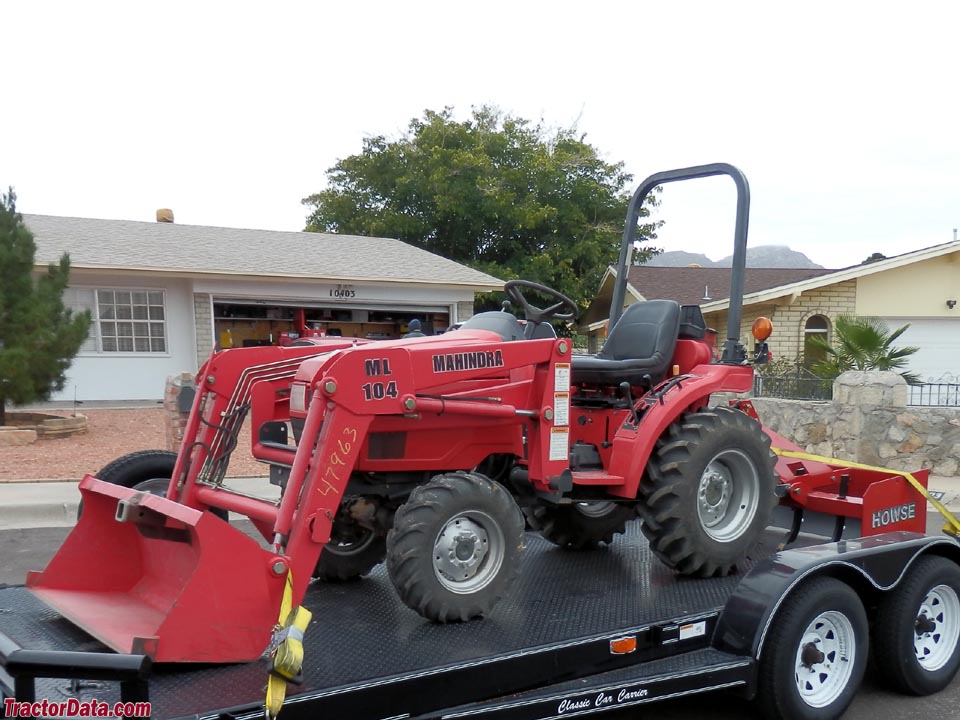 Mahindra 2015 with front-end loader and box blade.