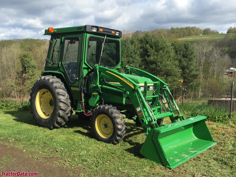 John Deere 990 with H165 front-end loader, right side.