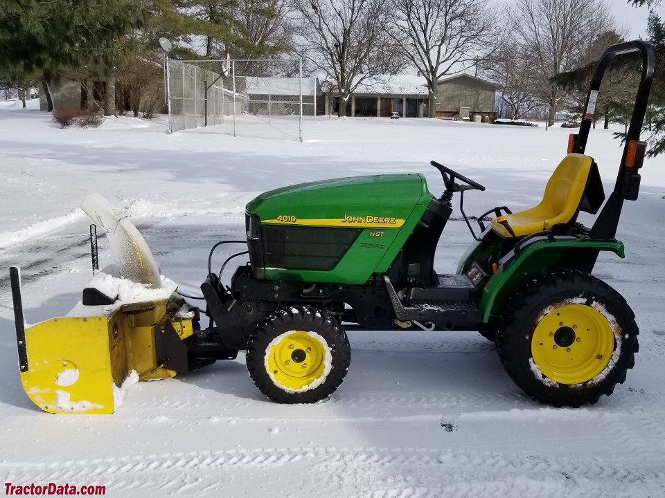 John Deere 4010 with front-mount snowblower.