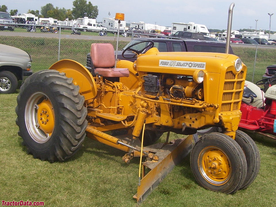 Ford 971 in highway yellow paint with road grader.