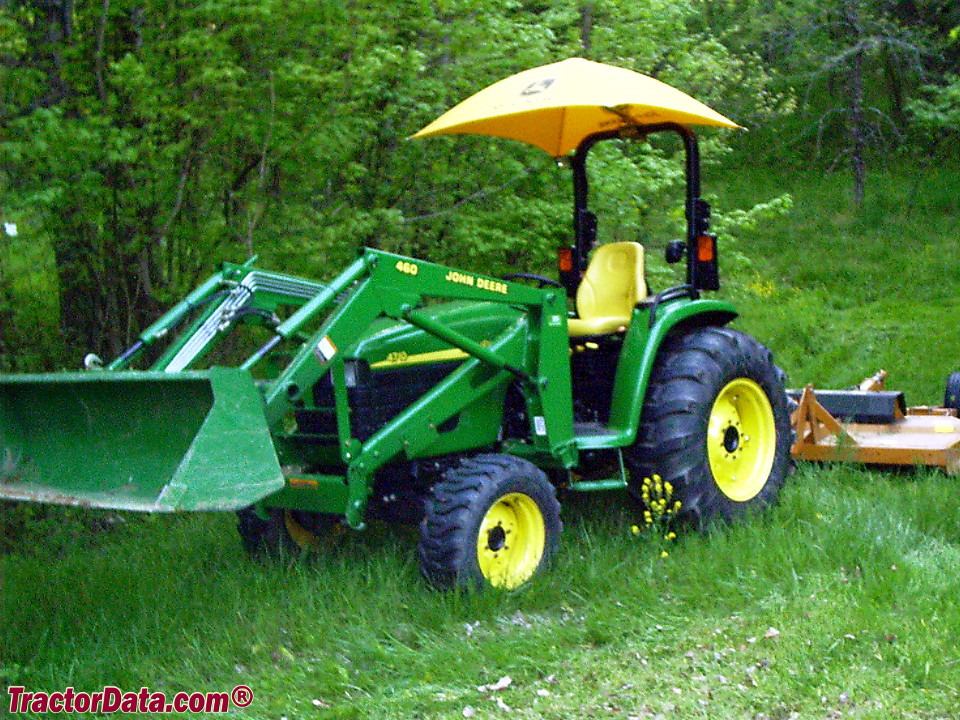 John Deere 4710 with 460 front-end loader and Woods 208 mower.