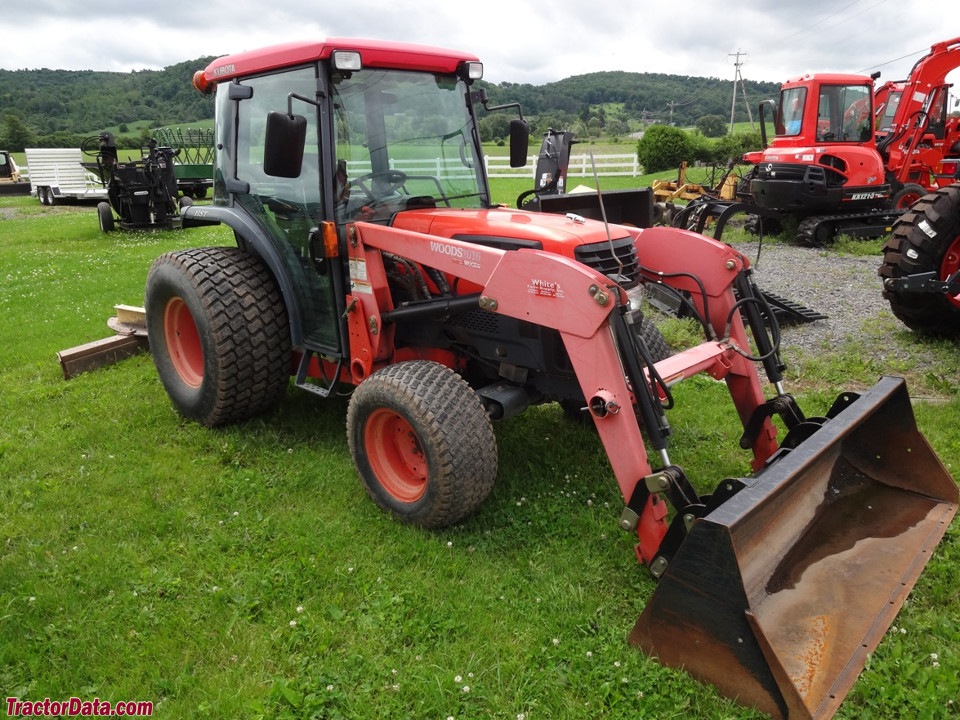 Kubota L4330 with cab and front-end loader.