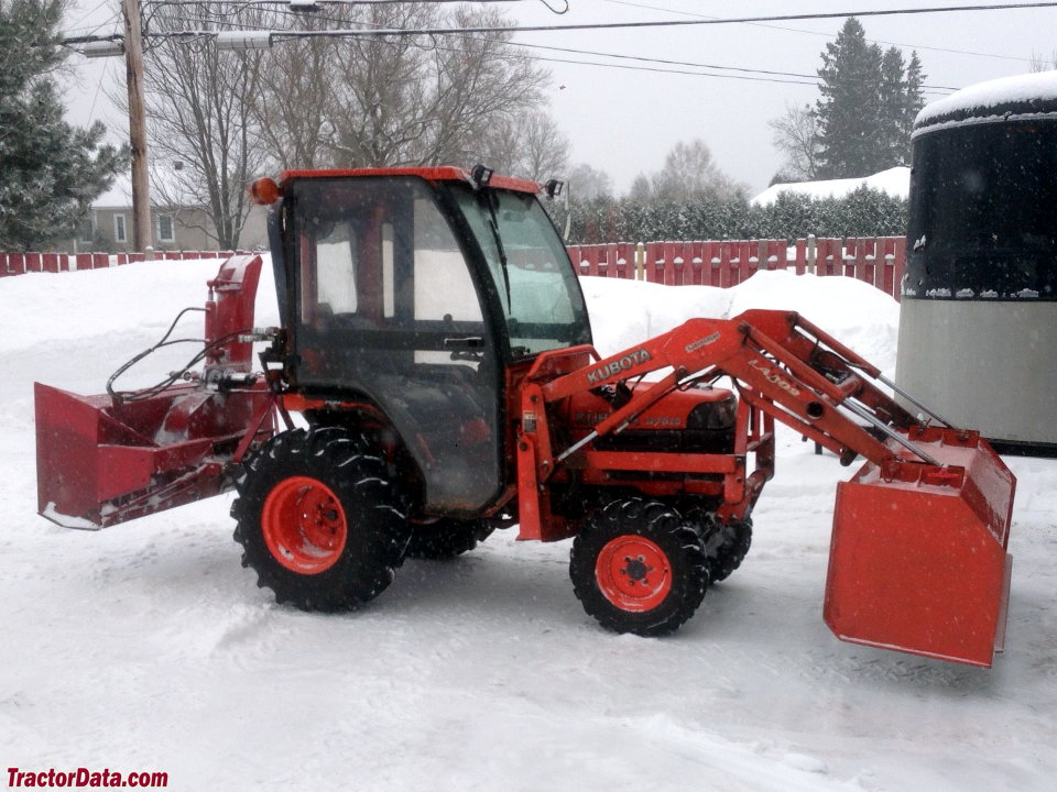 2005 Kubota B7610 with LA302 front-end loader, Curtis cab, and rear snow blower.