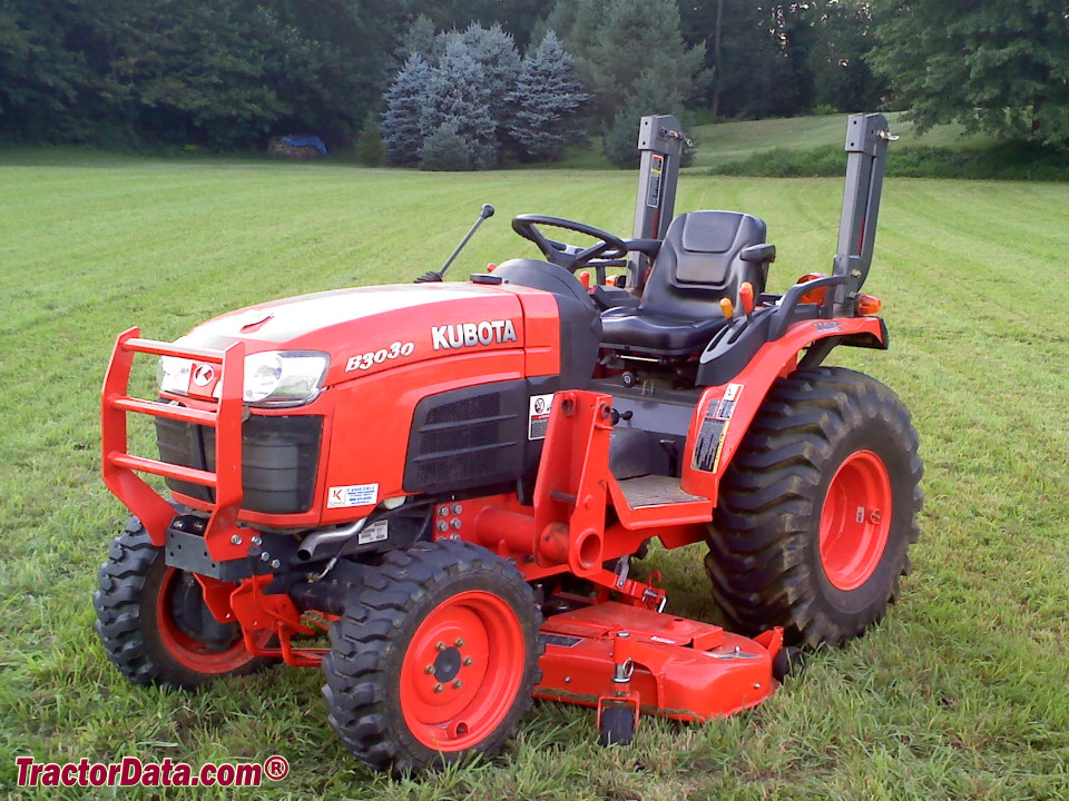 Kubota B3030 compact utility tractor with mid-mount mower, left side.