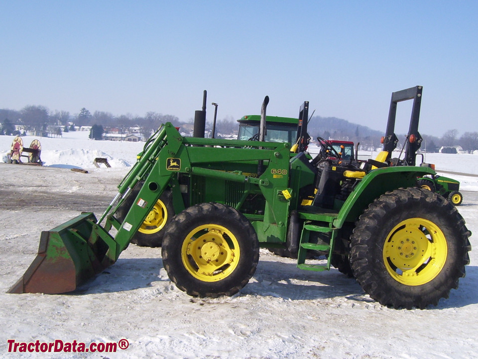 Four-wheel drive John Deere 6110 utility tractor with ROPS and 640 front-end loader.