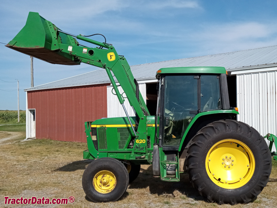 Two-wheel drive John Deere 6110 utility tractor with cab and 620 front-end loader.