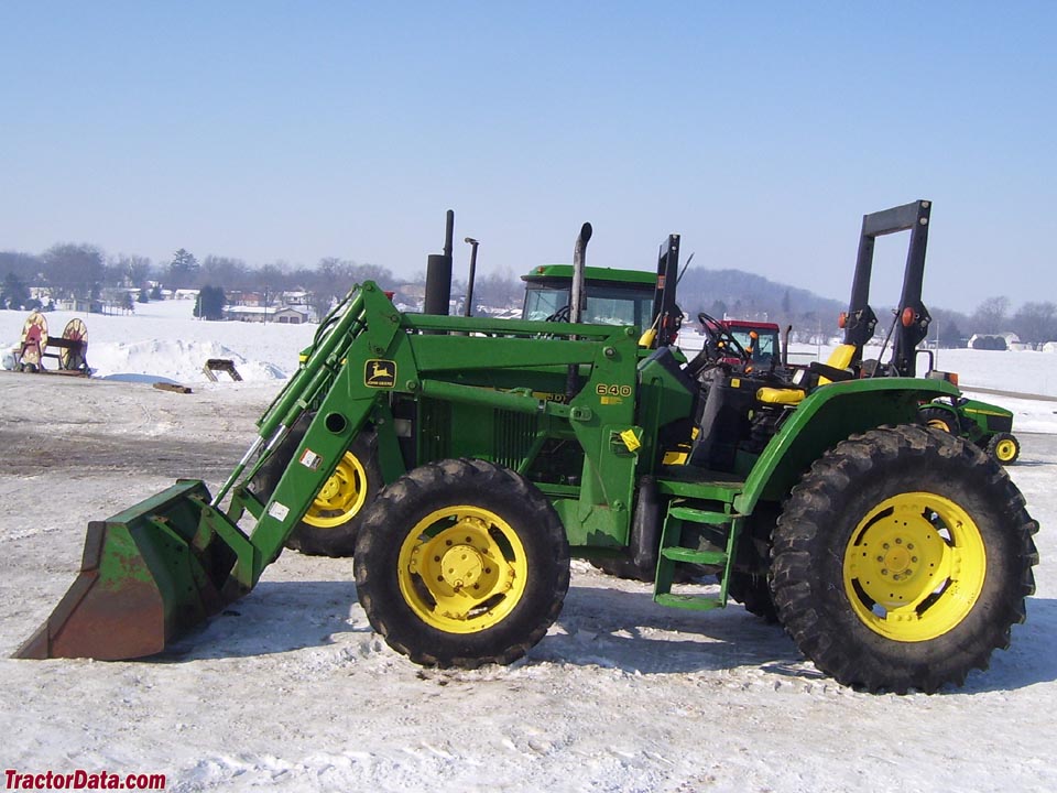 John Deere 6110 with ROPS and front-end loader.