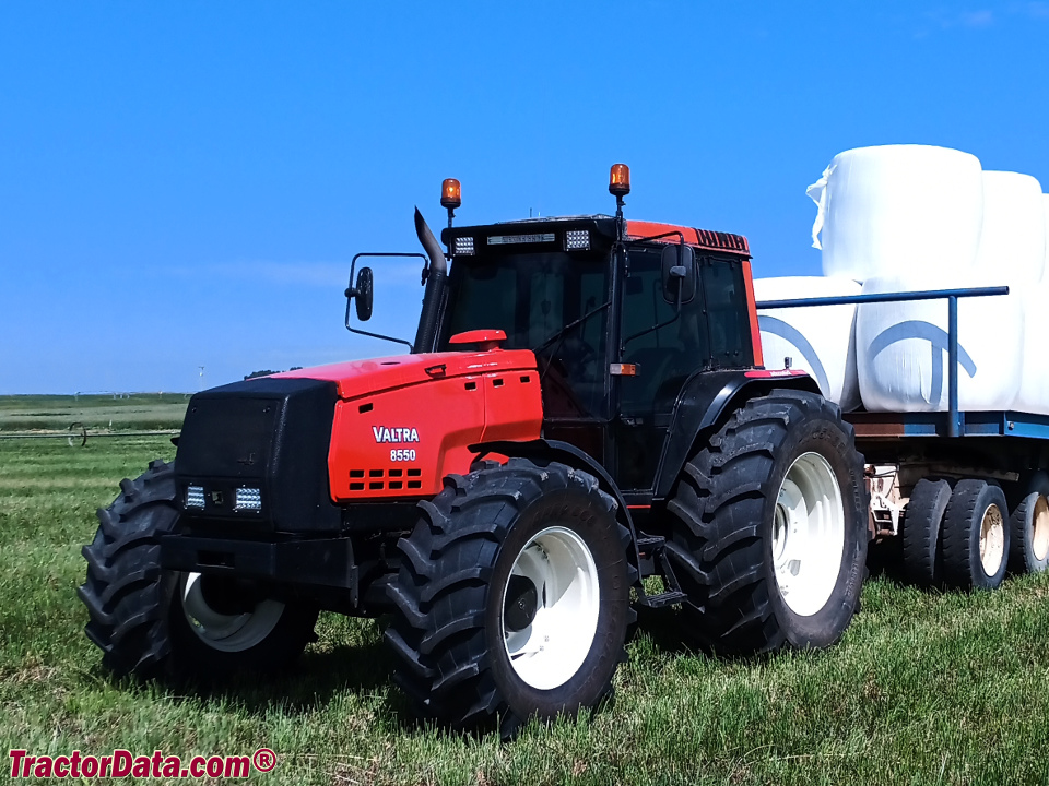 Valtra 8550 towing bales.