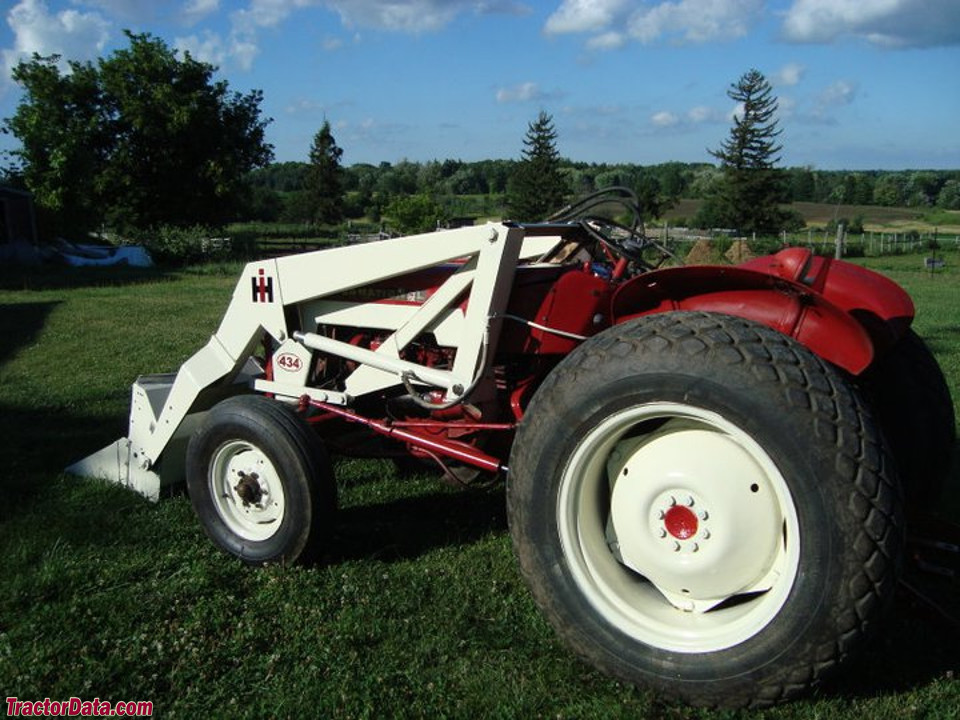 Restored International 434 with front-end loader.