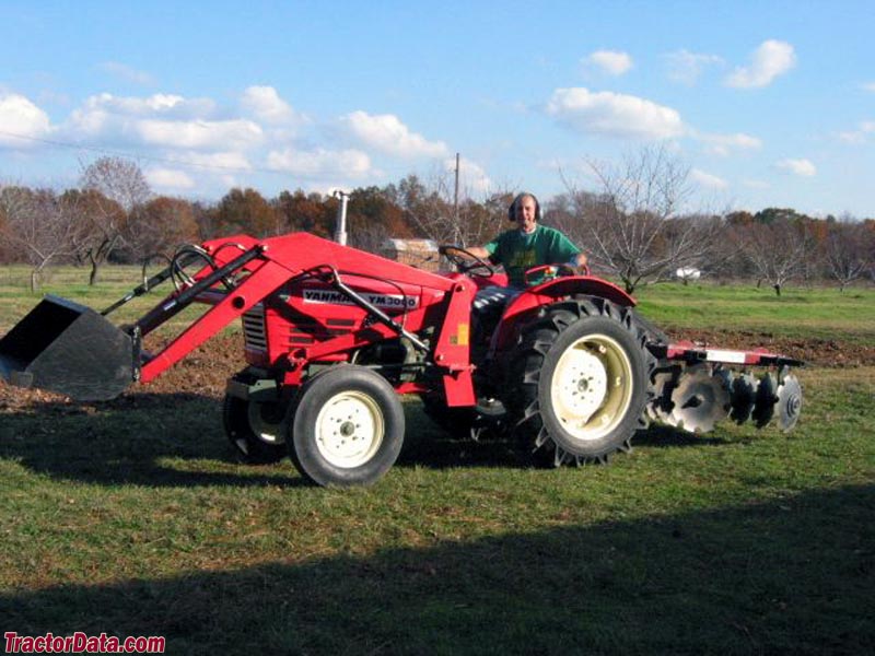 Two-wheel drive Yanmar YM3000 with front-end loader and disc.