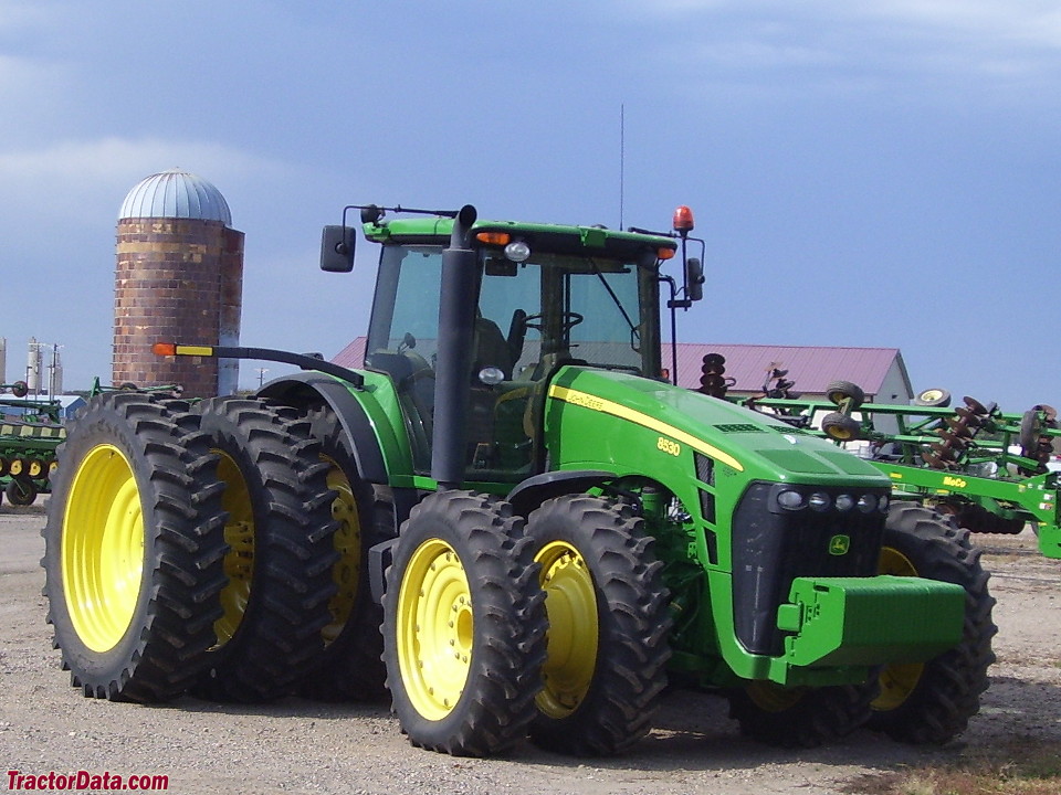 John Deere 8530 with rear triples and front duals.