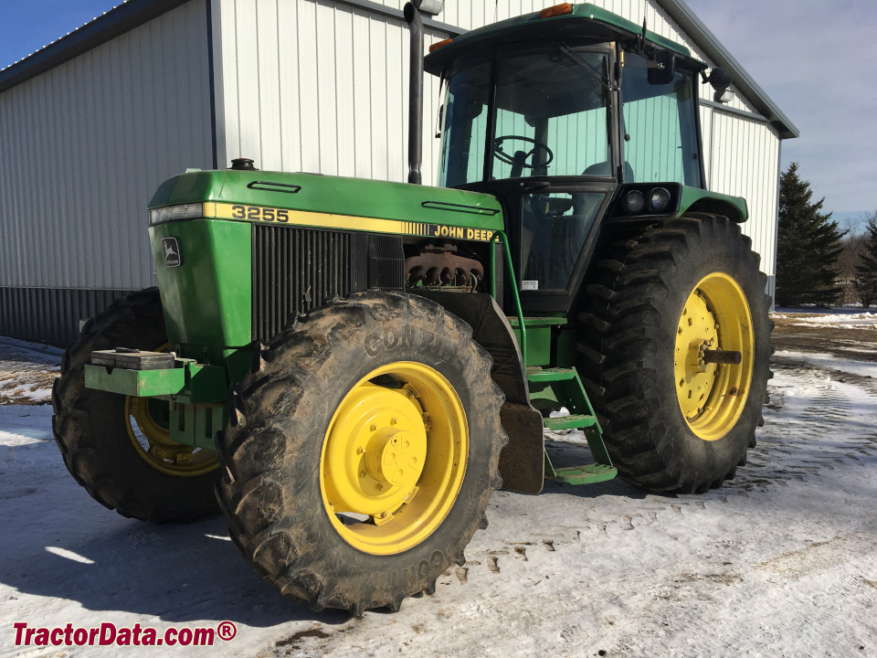 John Deere 3255 utility tractor with cab, left side.