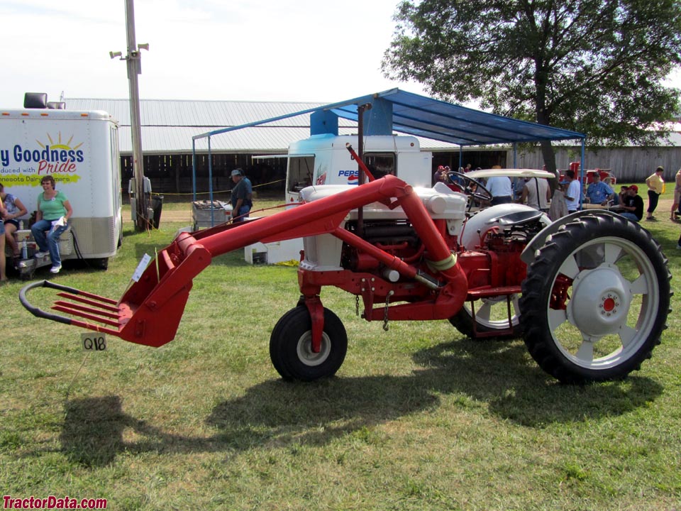 Ford 940 with single-front wheel and one-arm front-end loader.