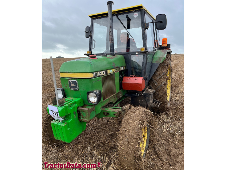 Two-wheel drive John Deere 1140 utility tractor with cab.