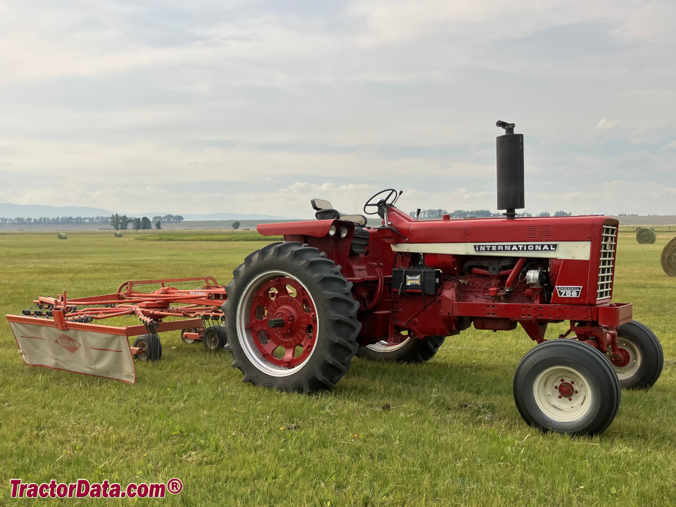 Farmall 756 with hay tedder.