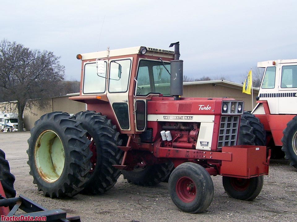 Farmall 1466 with after-market cab and duals.