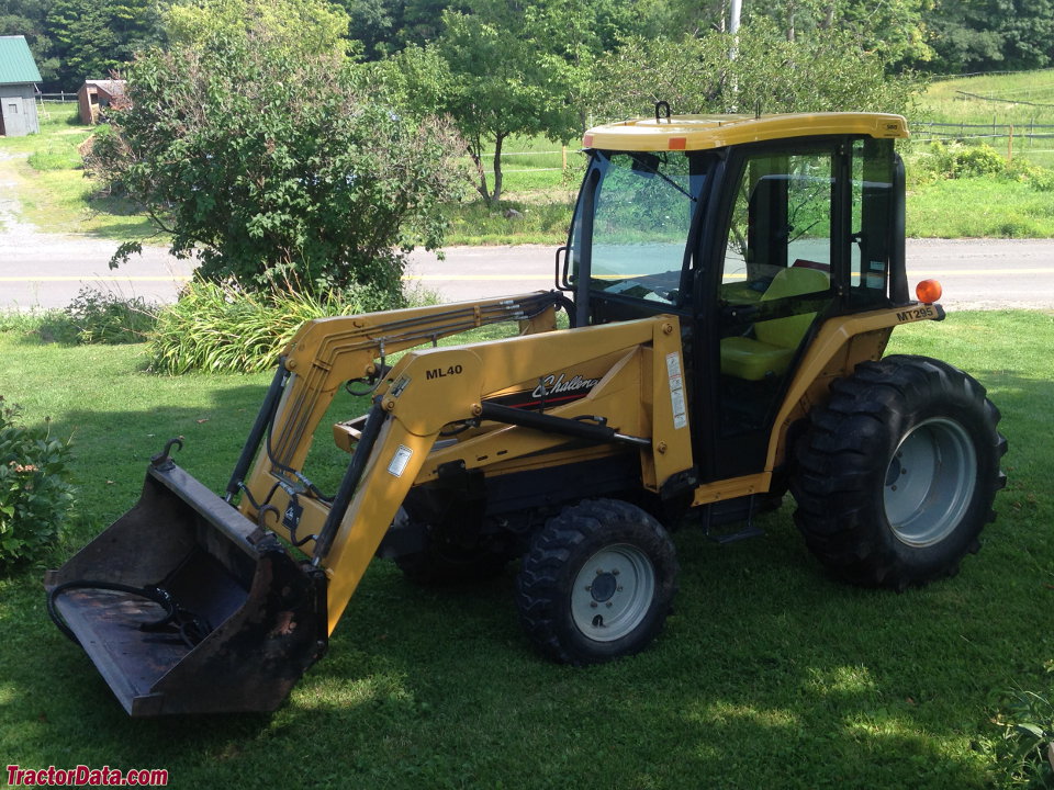 Challenger MT295 with ML40 loader and after-market cab, left side.