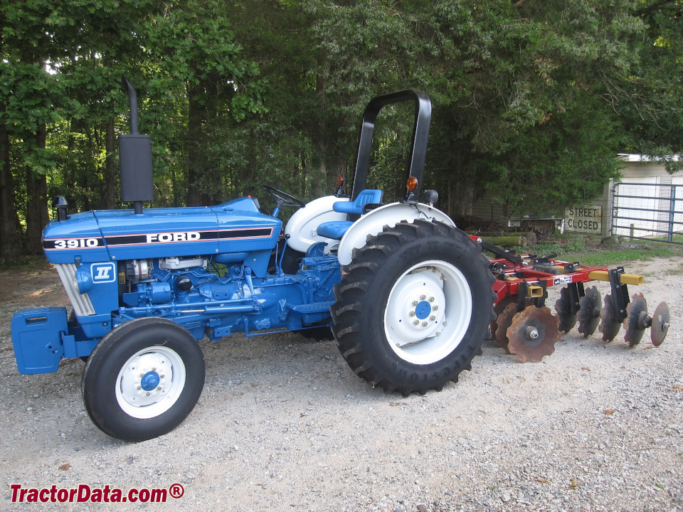 Ford 3910 Series II utility tractor with disc.