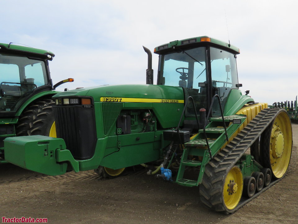 John Deere 8300T with mounted tanks.