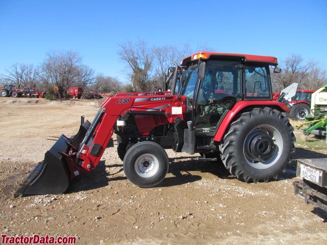 Case IH Farmall 95 with two-wheel drive, cab, and front-end loader.