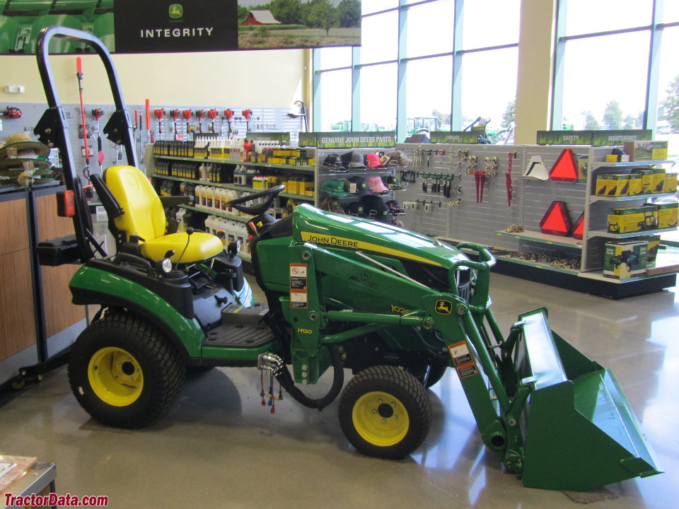 John Deere 1026R with loader.