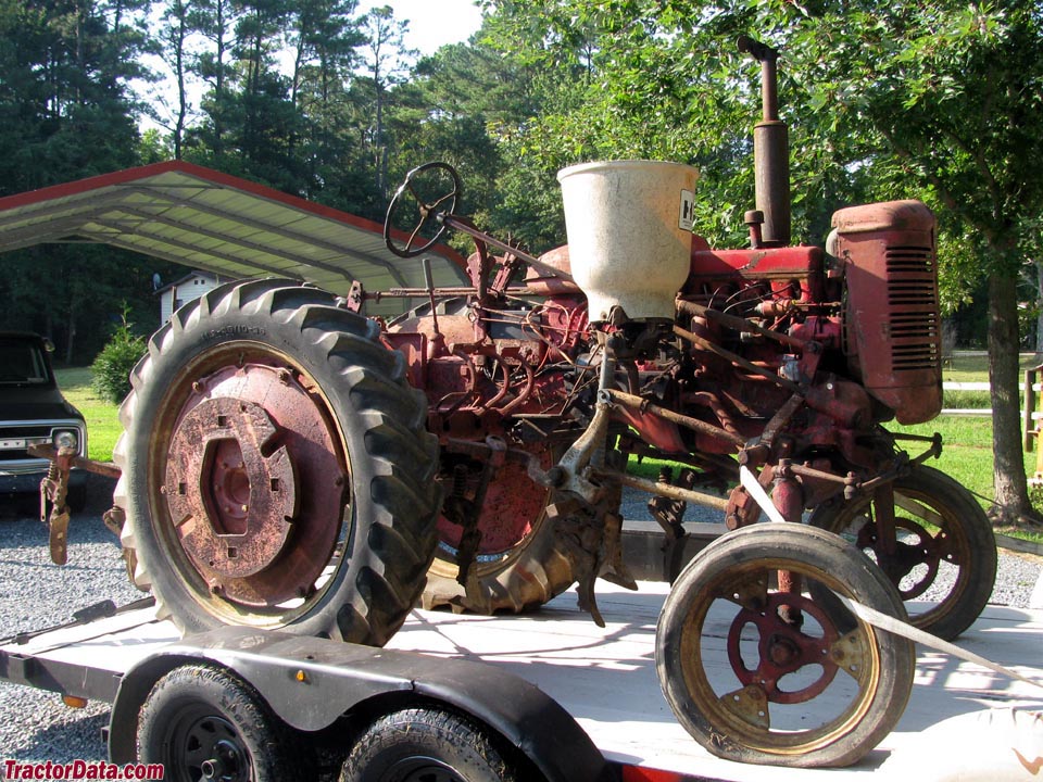 Farmall Super AV with mounted cultivators and hopper.