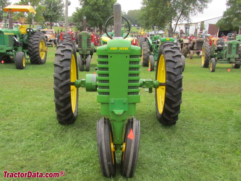 Early-styled John Deere model B tractor.